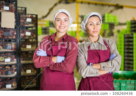 Portrait two womens in peach warehouse Portrait two womens in peach warehouse 108260436