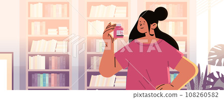 woman holding oral contraceptive pink pills for erection birth control pill concept prevention HIV and AIDS item for relax sex and wellness 108260582