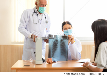 Doctor Team examining and checking at chest and lung x ray film  Doctor Team examining and checking at chest and lung x ray film  108261817