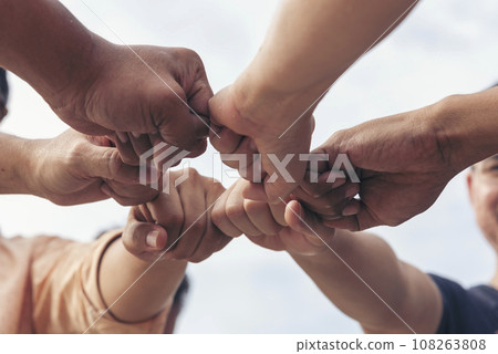 Close up hands Teamwork group of multi racial people meeting join hands. Diversity people hands join empower partnership teams connect volunteer community. Diverse multiethnic Partners team together Close up hands Teamwork group of multi racial people meeting join hands. Diversity people hands join empower partnership teams connect volunteer community. Diverse multiethnic Partners team together 108263808