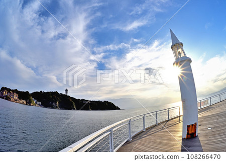 Enoshima seen behind the lighthouse at Katase fishing port Enoshima seen behind the lighthouse at Katase fishing port 108266470