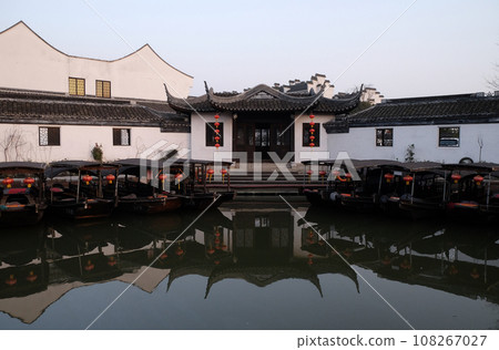 Chinese architecture and buildings lining the water canals to Xitang town in Zhejiang Province, China Chinese architecture and buildings lining the water canals to Xitang town in Zhejiang Province, China 108267027