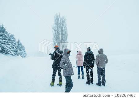 tourist Visiting in Biei, Traveler in Sweater sightseeing Tree of Ken and Marry with Snow in winter season. landmark and popular for attractions in Hokkaido, Japan. Travel and Vacation concept tourist Visiting in Biei, Traveler in Sweater sightseeing Tree of Ken and Marry with Snow in winter season. landmark and popular for attractions in Hokkaido, Japan. Travel and Vacation concept 108267465