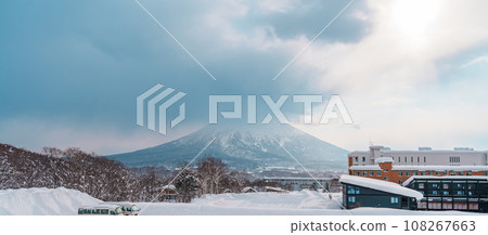 Beautiful Yotei Mountain with Snow in winter season at Niseko. landmark and popular for Ski and Snowboarding tourists attractions in Hokkaido, Japan. Travel and Vacation concept Beautiful Yotei Mountain with Snow in winter season at Niseko. landmark and popular for Ski and Snowboarding tourists attractions in Hokkaido, Japan. Travel and Vacation concept 108267663