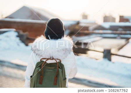 Woman tourist Visiting in Hakodate, Traveler in Sweater sightseeing Kanemori Red Brick Warehouse with Snow in winter. landmark and popular for attractions in Hokkaido,Japan.Travel and Vacation concept Woman tourist Visiting in Hakodate, Traveler in Sweater sightseeing Kanemori Red Brick Warehouse with Snow in winter. landmark and popular for attractions in Hokkaido,Japan.Travel and Vacation concept 108267762