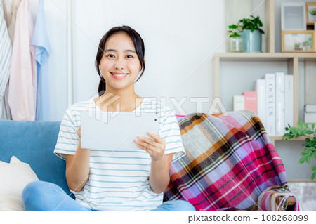 living room tablet woman 108268099