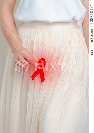woman with Red Ribbon for December World Aids Day, acquired immune deficiency syndrome, Sexual Transmitted diseases, Syphilis, Chancroid, Genital Herpes, Gonorrhea, Healthcare and world cancer day 108268134