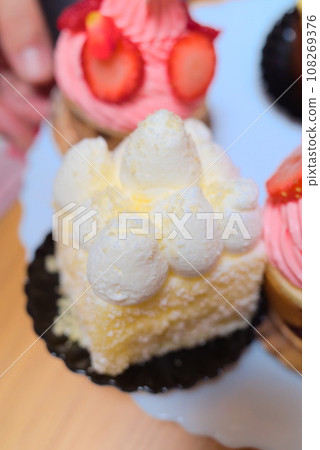 Square cheesecake with lots of cream Square cheesecake with lots of cream 108269376