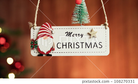 Merry Christmas patch with blurred tree in the background  108270331