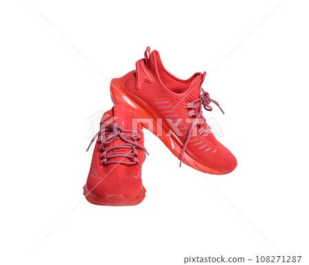 Red running shoes isolated on white background. Red running shoes isolated on white background. 108271287