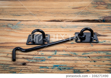 Door hook on wood texture background. Object Door hook on wood texture background. Object 108271490