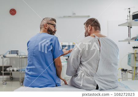Supportive doctor soothing a worried overweight patient, discussing test result in emergency room. Illnesses and diseases in middle-aged men's health. Compassionate physician supporting stressed 108272023