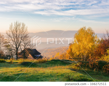 mountainous rural landscape at sunrise in autumn. carpathian countryside scenery in morning light mountainous rural landscape at sunrise in autumn. carpathian countryside scenery in morning light 108272511