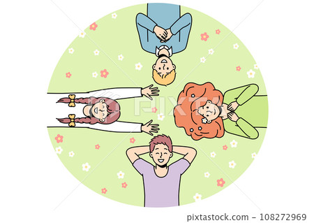 Guys, girls lie on grass among flowers, look at sky. Guys, girls lie on grass among flowers, look at sky. 108272969