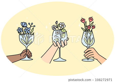 Hands of multiracial people holds wineglasses with flowers. 108272971