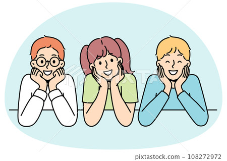 Children sit, watch, rest their chins with hands. 108272972