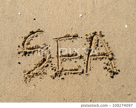 The letters "SEA" written on the sandy beach. The letters "SEA" written on the sandy beach. 108274097