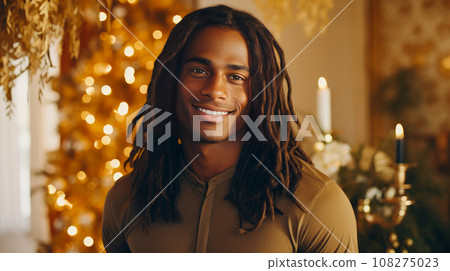 elegant sexy smiling African man with dark and perfect skin and long hair, on a golden background. 108275023