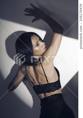 Sexy female underwear model in studio Sexy female underwear model in studio 108276459