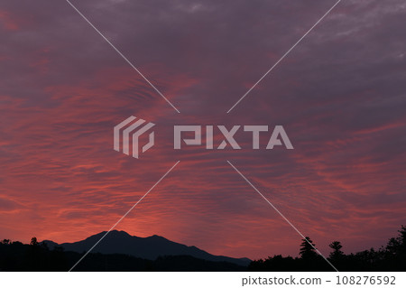 Hakushu-cho, Hokuto City, the sky above Mt. Chigatake turns red in the morning glow Hakushu-cho, Hokuto City, the sky above Mt. Chigatake turns red in the morning glow 108276592