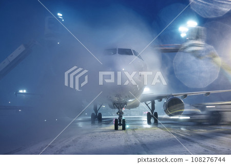 Deicing of airplane at airport. Deicing of airplane at airport. 108276744