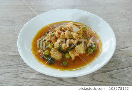 spicy fried pork bone with eggplant in coconut milk curry on plate spicy fried pork bone with eggplant in coconut milk curry on plate 108278152