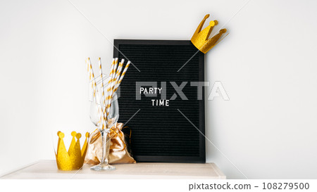Party time fun celebration event minimal concept with blackboard with text Party time on white. Party supplies, banners, balloons and event rentals for birthdays, graduation parties, anniversaries 108279500