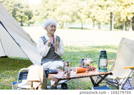 Cute lady enjoying camping 108279789