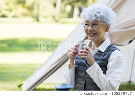 Cute lady enjoying camping 108279797
