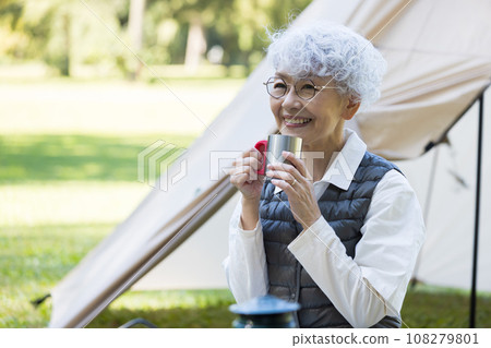 Cute lady enjoying camping Cute lady enjoying camping 108279801