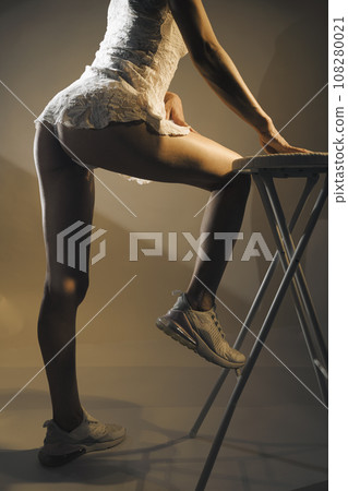 Sensuous lingerie model posing in studio Sensuous lingerie model posing in studio 108280021