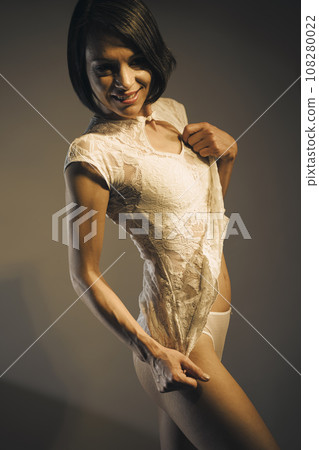 Sensuous lingerie model posing in studio 108280022