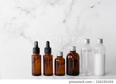 Arrangement of cosmetic bottles on marble background Arrangement of cosmetic bottles on marble background 108280269
