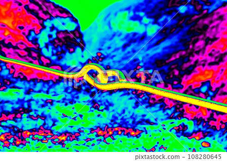 Steel rope as handrail at path via ferrata.  Ultraviolet view 108280645