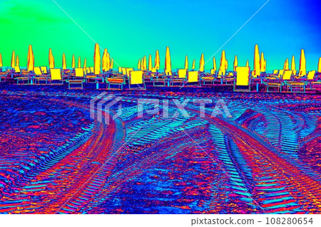 Dark clouds above hot beach with parasols and chairs Dark clouds above hot beach with parasols and chairs 108280654