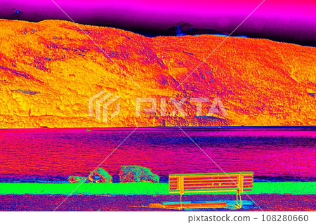 Lake between mountain and the bench at the bank. Ultraviolet view Lake between mountain and the bench at the bank. Ultraviolet view 108280660