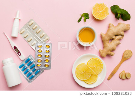 Natural cold and flu home remedies. Natural ingredients for immunity stimulation and viruses protection. top view flat lay Natural cold and flu home remedies. Natural ingredients for immunity stimulation and viruses protection. top view flat lay 108281023