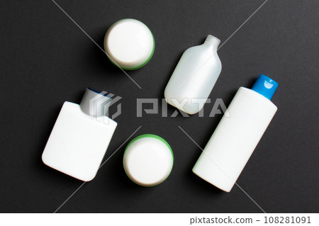 Cosmetics SPA branding mock-up, top view with copy space. set of tubes and jars of cream flat lay on colored background Cosmetics SPA branding mock-up, top view with copy space. set of tubes and jars of cream flat lay on colored background 108281091