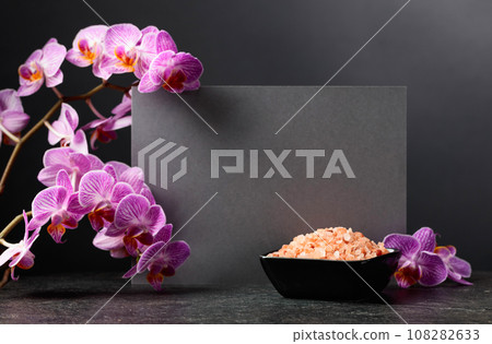 Beautiful blooming orchid flowers and pink sea salt. Beautiful blooming orchid flowers and pink sea salt. 108282633