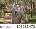 Funny old man with a stick. 108283472
