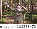 Funny old man with a stick. 108283473