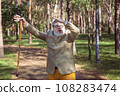 Funny old man with a stick. 108283474
