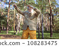 Funny old man with a stick. 108283475