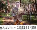 Funny old man with a stick. 108283489