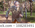 Funny old man with a stick. 108283491