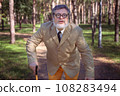Funny old man with a stick. 108283494