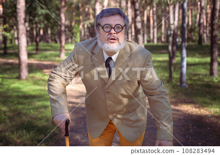 Funny old man with a stick. Funny old man with a stick. 108283494