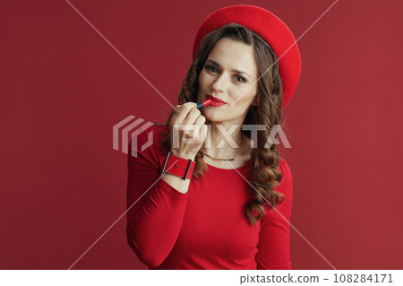 modern 40 years old woman in red dress and beret modern 40 years old woman in red dress and beret 108284171