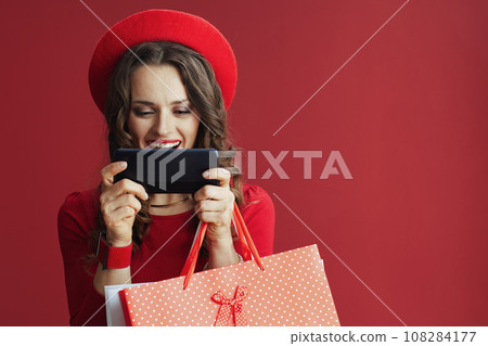 happy woman isolated on background using phone happy woman isolated on background using phone 108284177