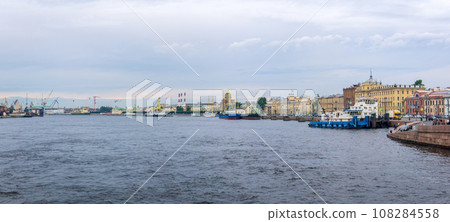 cityscape of the historical center of Saint Petersburg, view of the Lieutenant Schmidt embankment from the Annunciation Bridge over the Neva River 108284558